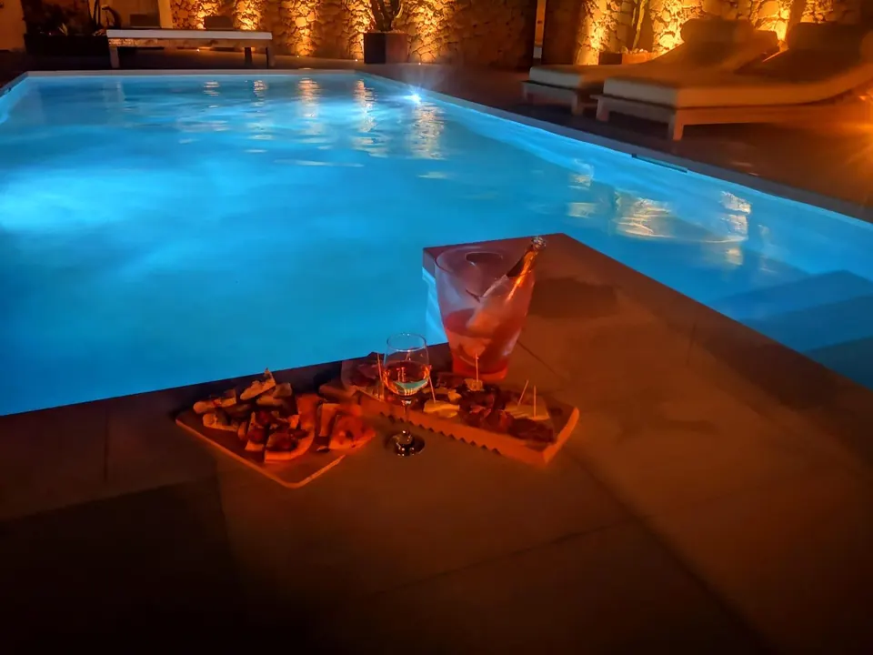 Aperitivo by the illuminated pool