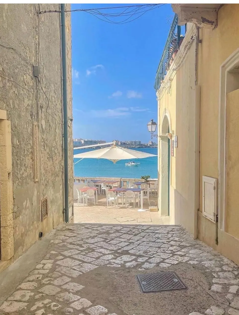 Alley in the old town with a view of the sea